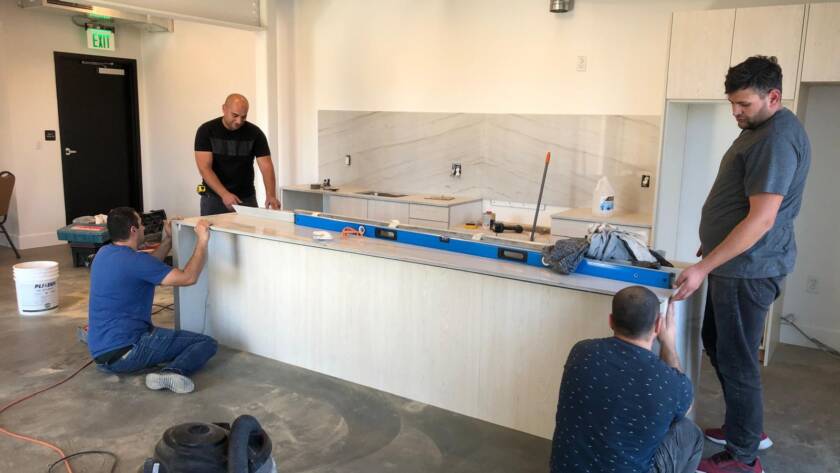 Couple celebrating home purchase – Elegant Design Construction